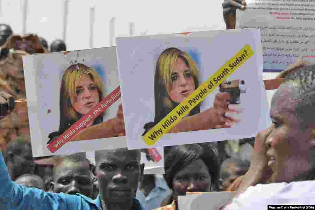 A protester holds up an sign against UNMISS head Hilde Johnson at a peace rally in Juba.