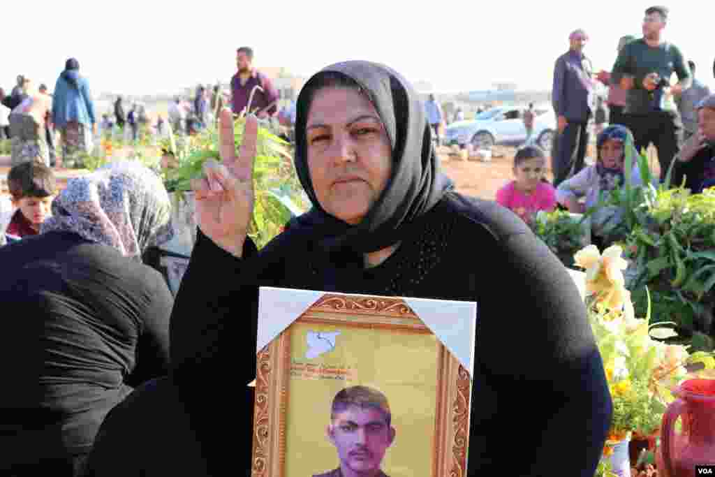 Displaced Afrin people visit the graves of their beloved ones in the eid