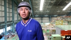 A manager for Asahi Breweries, Shinichi Uno, has one of the many unusual jobs of the future. He works with robots.