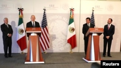 Secretary of Homeland Security John Kelly delivers a statement accompanied by U.S. Secretary of State Rex Tillerson (left), Mexico's Foreign Secretary Luis Videgaray (right), and Secretary of Government Angel Osorio (second from right) at the Ministry of Foreign Affairs in Mexico City, Feb. 23, 2017.