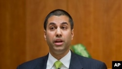 FILE - Federal Communication Commission Commissioner Ajit Pai speaks during a hearing in Washington. The FCC website was recently attacked.