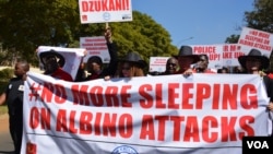 FILE - Petitioners march to Malawi's parliament to protest attacks on albinos in the country, in Lilongwe, Malawi, May 24, 2016.(L. Masina/VOA)