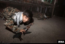 Iranian children are taught how to use firearms for battle, according to a post on Iran's state-run news agency IRNA.