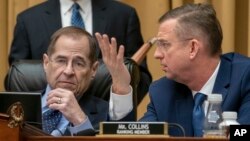 FILE - Judiciary Committee Chairman Jerrold Nadler, D-N.Y. (L), and Rep. Doug Collins, R-Georgia, the top Republican, confer during testimony by Acting Attorney General Matthew Whitaker on Capitol Hill, Feb. 8, 2019 in Washington. 