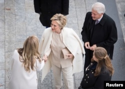 Former Secretary of State Hillary Clinton and former President Bill Clinton arrive prior to the inauguration for Donald Trump as 45th U.S. president in Washington, D.C., Jan. 20, 2017.