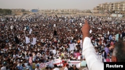 FILE - Members of Pakistan's Pashtun community listen to their leader during a rally in Karachi against what they said were human rights violations, May 13, 2018. The rally was organized by the Pashtun Tahaffuz Movement. 