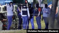 French policemen take part in a police raid at a residential building in Boussy-Saint-Antoine near Paris, France, Sept. 8, 2016. Police were investigating an abandoned car packed with gas cylinders near Paris' Notre Dame cathedral. 