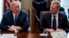 FILE - In this April 9, 2018 photo, Deputy Secretary of Defense Patrick Shanahan, right, listen as President Donald Trump speaks during a cabinet meeting at the White House, in Washington.