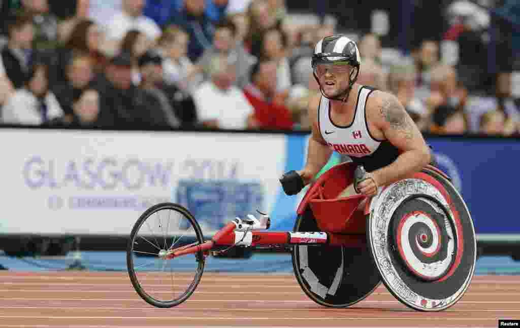 Canada's Josh Cassidy looks at the scoreboard after competing in Round 1 of the Men's Para-Sport 1500m T54 at the 2014 Commonwealth Games in Glasgow, Scotland.