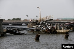 An oil discharge facility which was used to transfer imported oil from ships at the Atlas Cove depot, is seen damaged after militants from the Niger delta bombed it, in Lagos, Nigeria, Nov. 10, 2016.