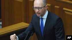 Ukrainian Prime Minister Arseniy Yatsenyuk speaks to the parliament in Kyiv, Ukraine, July 24, 2014. 