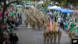 Members of the Georgia Southern University Army ROTC Eagle Battalion march in the 195-year-old Savannah St. Patrick's Day Parade, March 16, 2019, in Savannah, Ga.