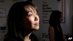 Winner of the 2016 Man Booker International prize for fiction Han Kang speaks to the media after winning the award for her book, "The Vegetarian," after the award ceremony in London on Tuesday, May 16.