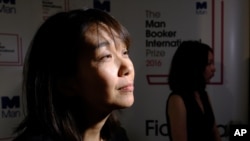 Winner of the 2016 Man Booker International prize for fiction Han Kang speaks to the media after winning the award for her book 'The Vegetarian' after the award ceremony in London, Tuesday, May, 16, 2016.
