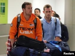 U.S. Swimmers Jack Conger and Gunnar Bentz arrive on an overnight flight from Brazil to Miami in Miami, August 19, 2016.