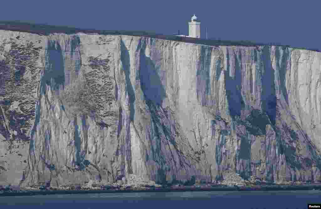 South Foreland lighthouse and the white cliffs of Dover are seen from a cross-channel ferry between Dover in Britain and Calais in France.