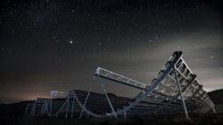 This November 2016 photo provided by the Canadian Hydrogen Intensity Mapping Experiment collaboration shows the CHIME radio telescope at the Dominion Radio Astrophysical Observatory in Kaleden, British Columbia, Canada. (Andre Renard/University of Toront