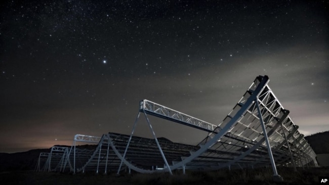 This November 2016 photo provided by the Canadian Hydrogen Intensity Mapping Experiment collaboration shows the CHIME radio telescope at the Dominion Radio Astrophysical Observatory in Kaleden, British Columbia, Canada. (Andre Renard/University of Toront