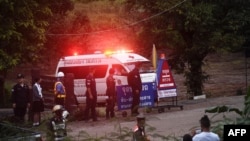 An ambulance leaves the Tham Luang cave area after divers evacuated some of the 12 boys and their coach trapped at the cave in Khun Nam Nang Non Forest Park in the Mae Sai district of Chiang Rai province on July 8, 2018.