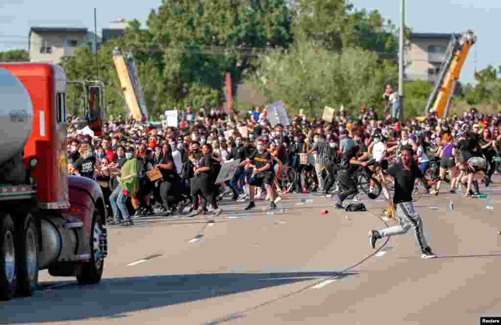 A tanker truck drives into thousands of protesters marching on 35W north bound highway during a protest against the death of George Floyd, in Minneapolis, Minnesota, May 31, 2020.