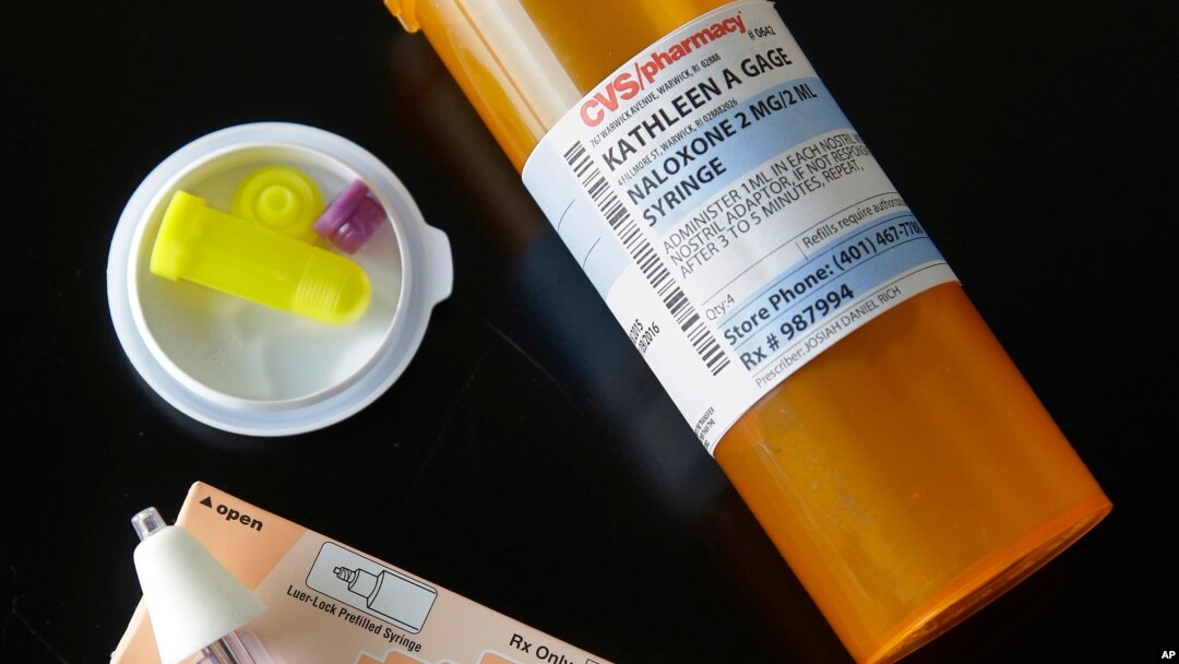 FILE - A nasal dose of Narcan is seen Pilgrim High School in Warwick, R.I., Sept. 2, 2015. A new state law requires middle and high schools to stock Narcan, which can reverse the effects of an overdose of drugs such as heroin or prescription painkillers.