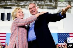 FILE - Democratic presidential candidate Hillary Clinton, accompanied by Sen. Tim Kaine, D-Va., speaks at a rally in Annandale, Va., July 14, 2016.