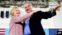 FILE - Democratic presidential candidate Hillary Clinton, accompanied by Sen. Tim Kaine, D-Va., speaks at a rally in Annandale, Va., July 14, 2016. Clinton has chosen Kaine to be her running mate in the 2016 presidential election.