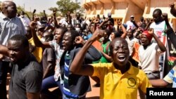 People hold a protest following an attack on security forces that killed 53 people, calling on Burkina Faso's President Roch Kabore to resign, in Ouagadougou, Burkina Faso, Nov. 16, 2021.