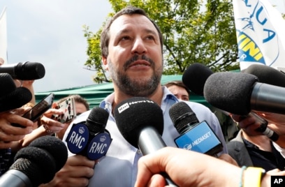 FILE - The League party leader, Matteo Salvini, meets reporters in Milan, Italy, May 19, 2018.