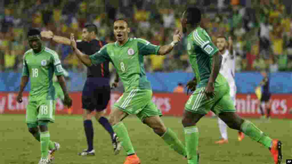 Nigeria's Peter Odemwingie, centre, celebrates after scoring his side's opening goal.