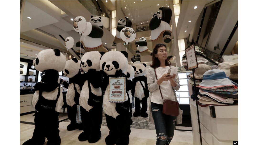 Workers wearing panda costumes attend a promotion event for Chinese tourists at a department store in Seoul, South Korea, Thursday, April 28, 2016.