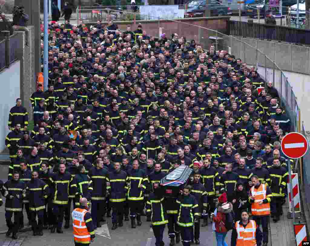 Firefighters take part in a demonstration to protest attacks against them during interventions in Strasbourg, eastern France.