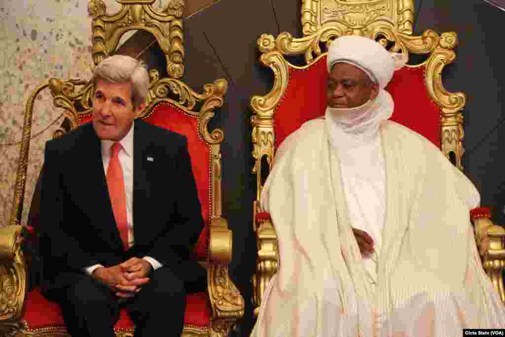 U.S. Secretary of State John Kerry, left, sits with Sultan of Sokoto Sa'adu Abubakar during a visit to the sultan's palace in Sokoto, Nigeria, Aug. 23, 2016.