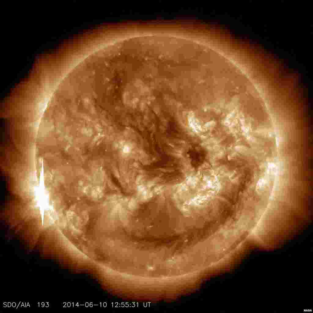 The dark area across the top of the sun in this image&nbsp; NASA&#39;s Solar Dynamics Observatory is a coronal hole, a region on the sun where the magnetic field is open to interplanetary space, sending coronal material speeding out in what is called a &quot;high-speed solar wind stream.&quot;