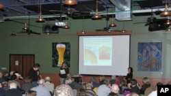 Organizer Cynthia Wichelman introduces a 'Science on Tap' speaker at the Schlafly Bottleworks.