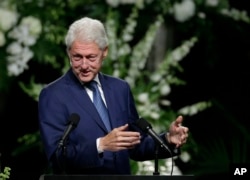 Former President Bill Clinton delivers a eulogy during Muhammad Ali's memorial service in Louisville, Ky., June 10, 2016.