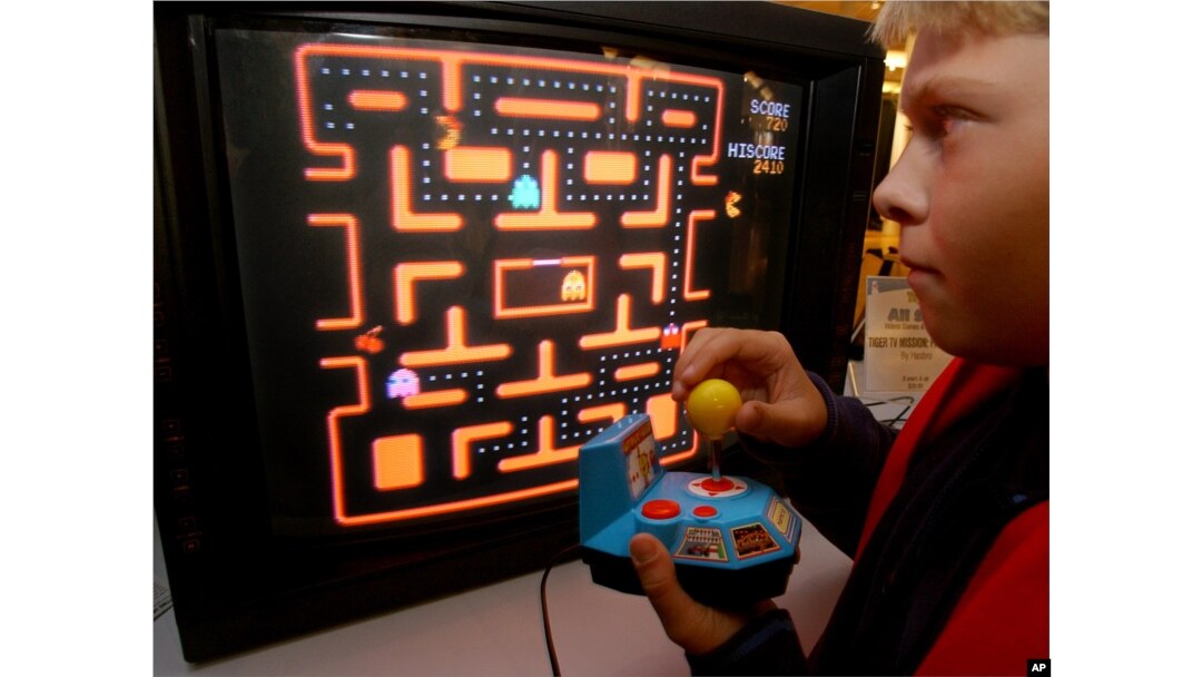 FILE - In this Oct. 5, 2004, photo, a youth tries a Ms. Pac-Man TV game in New York.