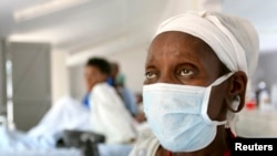 FILE 0 A patient who tested positive for extreme drug resistant tuberculosis (XDR-TB) awaits treatment at a rural hospital at Tugela Ferry in South Africa's impoverished KwaZulu Natal province.