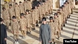 А YouTube screen grab from an Islamic State propaganda video shows child soldiers at an alleged IS training camp. Many of the children are reportedly taken from captured families and civilians living in IS-controlled areas.