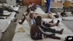 FILE - Victims receive treatment at a hospital, after an explosion in Maiduguri, Borno state, Nigeria, Sept. 21, 2015. Two out of three health facilities in the state our now cliosed or idle, the World Health Organization reports.