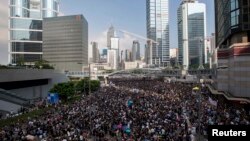 Protesters block the main road to the financial Central district in Hong Kong, Sept. 29, 2014. 