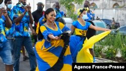 Women dance during a cultural presentation during the official opening of the Golden Square Freedom Park in Bridgetown, Barbados, on Nov. 27, 2021.