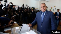 Boyko Borisov, leader of Bulgaria's center right GERB party, casts his vote in Sofia Oct. 5, 2014.