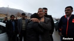 Relatives of a passenger who was believed to have been killed in a plane crash react near the town of Semirom, Iran, Feb. 18, 2017. (REUTERS/Tasnim News Agency)