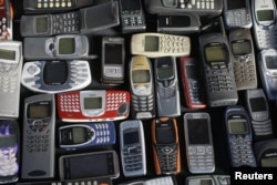 A collection of mobile phones made by Nokia is pictured in this photo illustration taken in Warsaw May 8, 2012. REUTERS/Kacper Pempel (POLAND - Tags: BUSINESS TELECOMS)