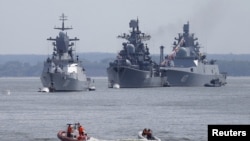 Russian war ships are seen anchored in a bay of the Russian fleet base in Baltiysk in Russia's Kaliningrad region between Poland and the Baltic states, July 19, 2015.