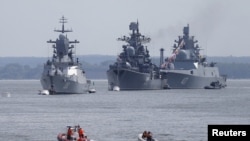 Russian war ships are seen anchored in a bay of the Russian fleet base in Baltiysk in Russia's Kaliningrad region between Poland and the Baltic states, July 19, 2015.