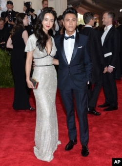 Tang Wei, left, and Chen Kun arrive at The Metropolitan Museum of Art's Costume Institute benefit gala celebrating "China: Through the Looking Glass" on May 4, 2015, in New York.