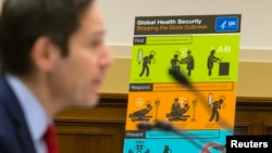 FILE - U.S. Centers for Disease Control and Prevention (CDC) Director Tom Frieden displays CDC educational materials as he testifies about the Ebola crisis in West Africa during a hearing of a House Foreign Affairs subcommittee on Capitol Hill in Washingt
