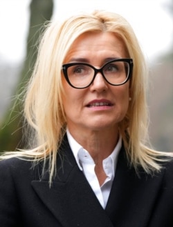 FILE - Ewa Wrzosek, a Polish prosecutor, stands outside her office, in Warsaw, Dec. 16, 2021.